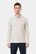 ligne jerem casual 
 col classique 
 fermeture à 3 boutons 
 ligne fine contrasté sur patte de boutonnage 
 manche longue 
 bas de manche en bord cùte 
 fente cùté contrasté